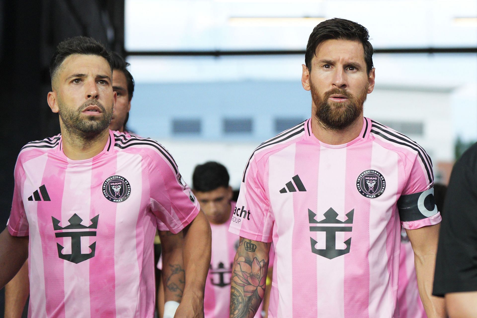 Jordi Alba (left) and Lionel Messi